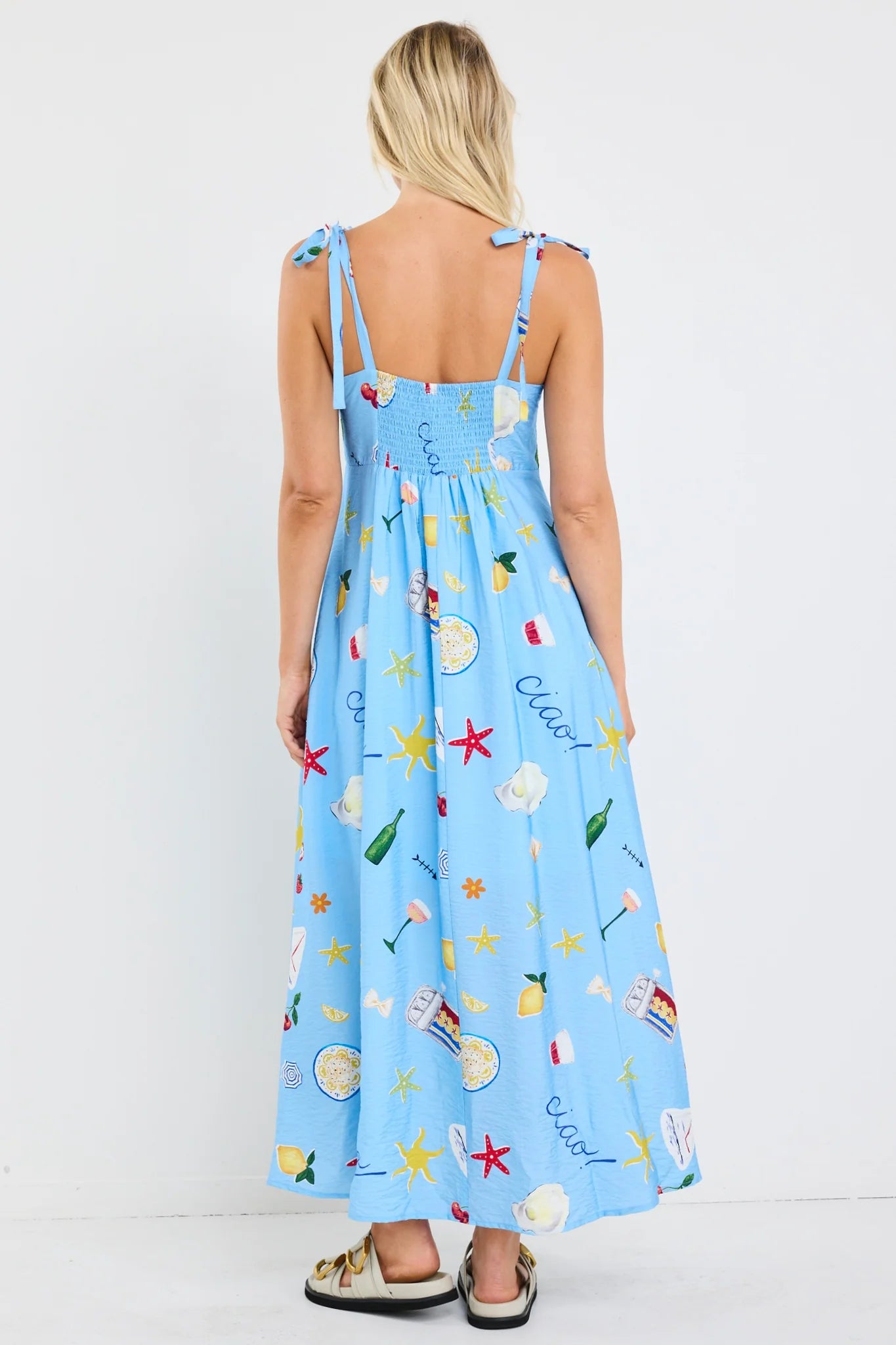 Portrait blue holiday tie strap maxi dress