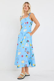Portrait blue holiday tie strap maxi dress