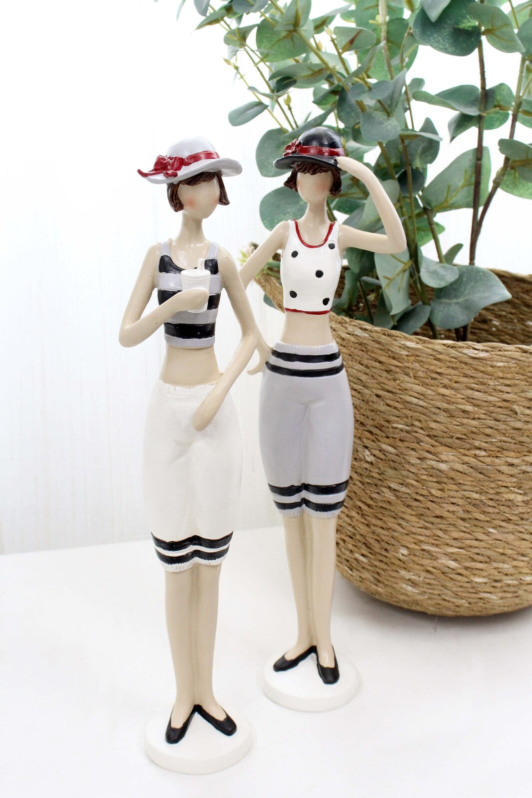 Vintage beach lady holding hat