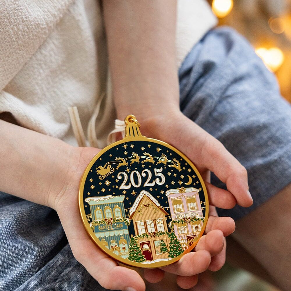 ORN44_2025-Christmas-Village-Enamel-Ornament.jpg