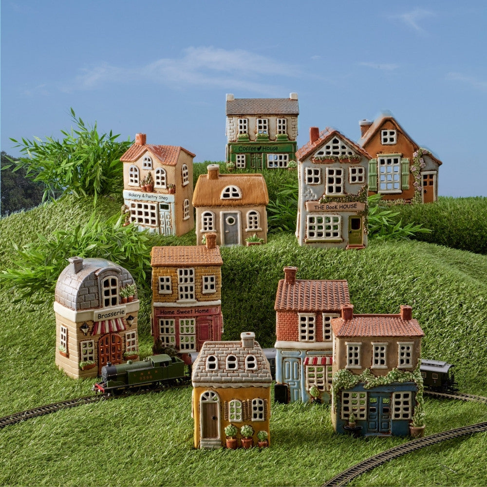 Pilbeam-Living-Tealight-Holder-Village-House-Musical-Toy-Rainbow_05ae9f25-cc35-466d-b223-19936f82e04b.jpg
