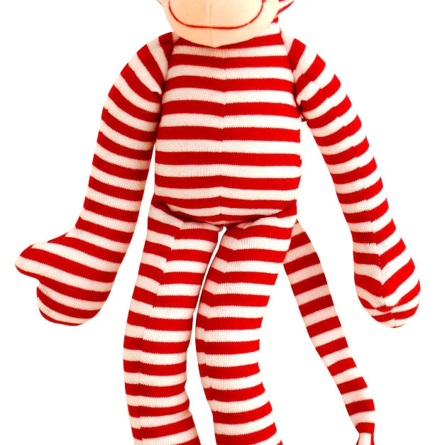 Alimrose Monkey Rattle 30cm in red and white stripes with beige face, ears, and long arms, legs, and tail.