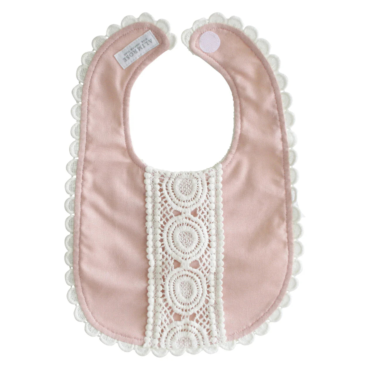 Alimrose Olivia Bib in pink linen shown open with white lace detail, scalloped trim, and Velcro closure.