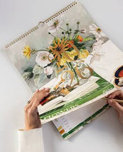 Bespoke Letterpress 2026 Family Wall Calendar with floral artwork, gold foil cover, and six-column layout for family planning.