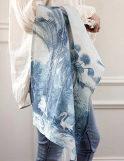 Bespoke Letterpress Subcontinent Linen Tea Towel with tropical palm and bird print, draped over arm