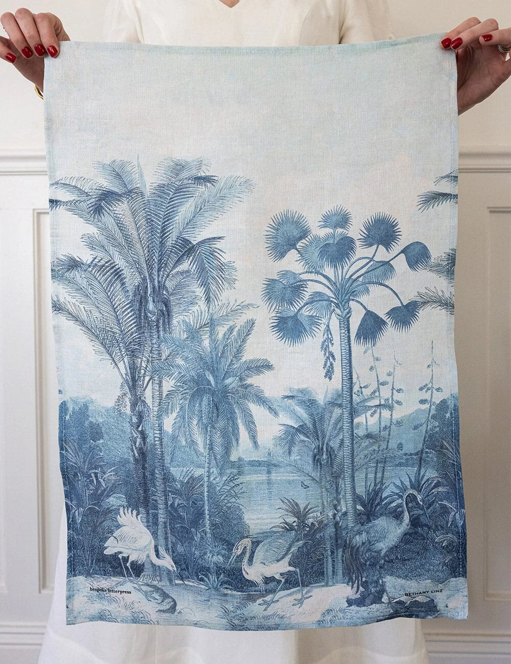 Bespoke Letterpress Subcontinent Linen Tea Towel featuring tropical palm trees and white heron print