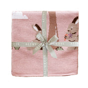 Alimrose Bunnies Day Out Baby Blanket in petal pink with bunny design, neatly folded and tied with branded ribbon.