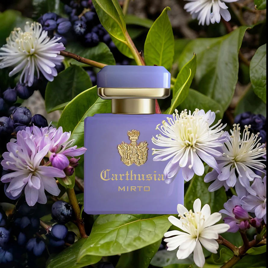 Carthusia Intenso di Mirto perfume bottle surrounded by Mediterranean myrtle flowers and berries