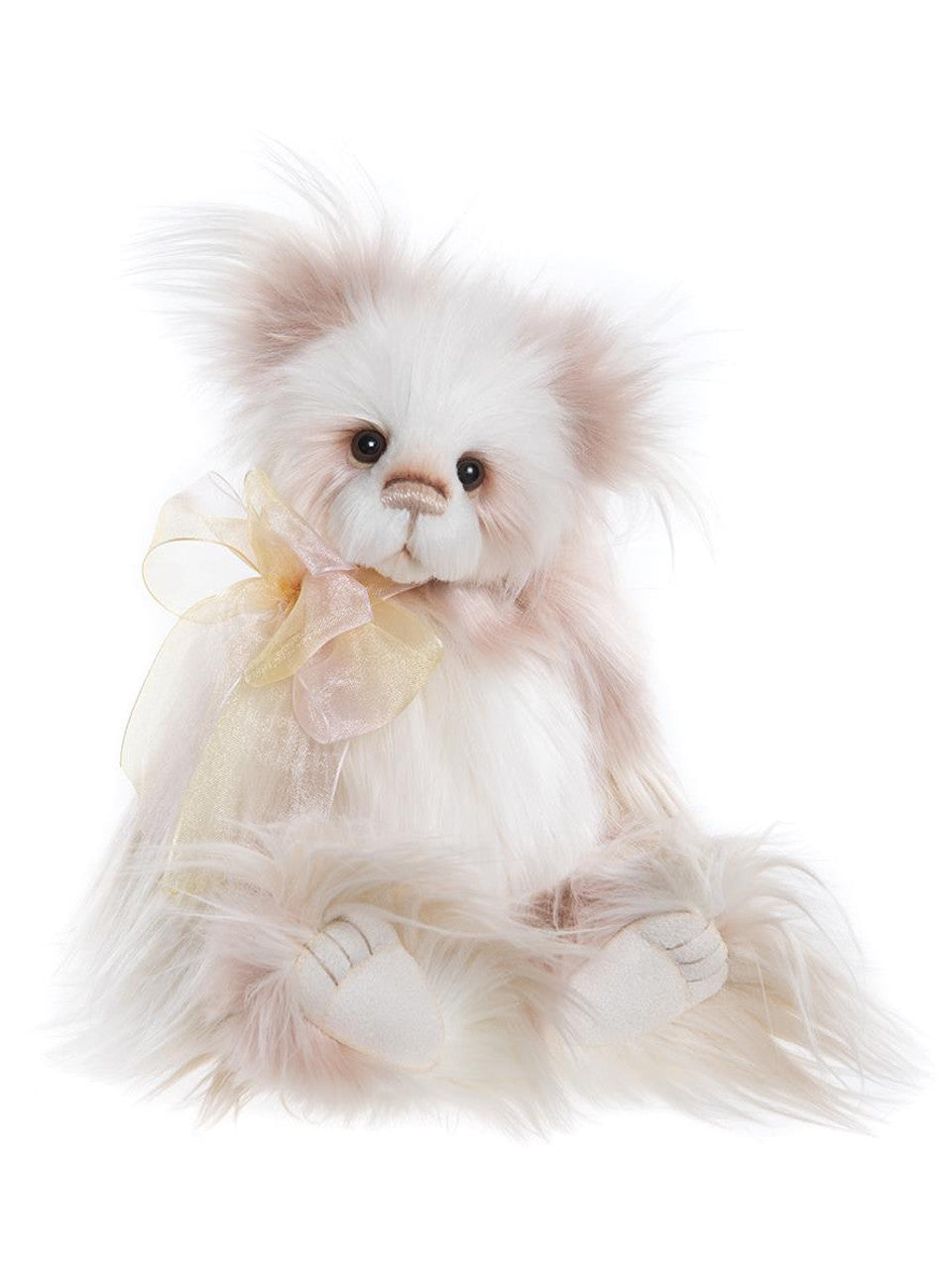 Charlie Bears Kaleena plush bear with long soft cream and blush fur, detailed paw pads, and a sheer golden bow.