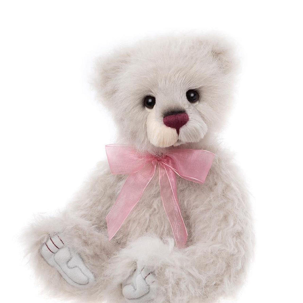 Charlie Bears Rosienna plush bear with soft white fur, burgundy nose, and a pink organza ribbon bow.