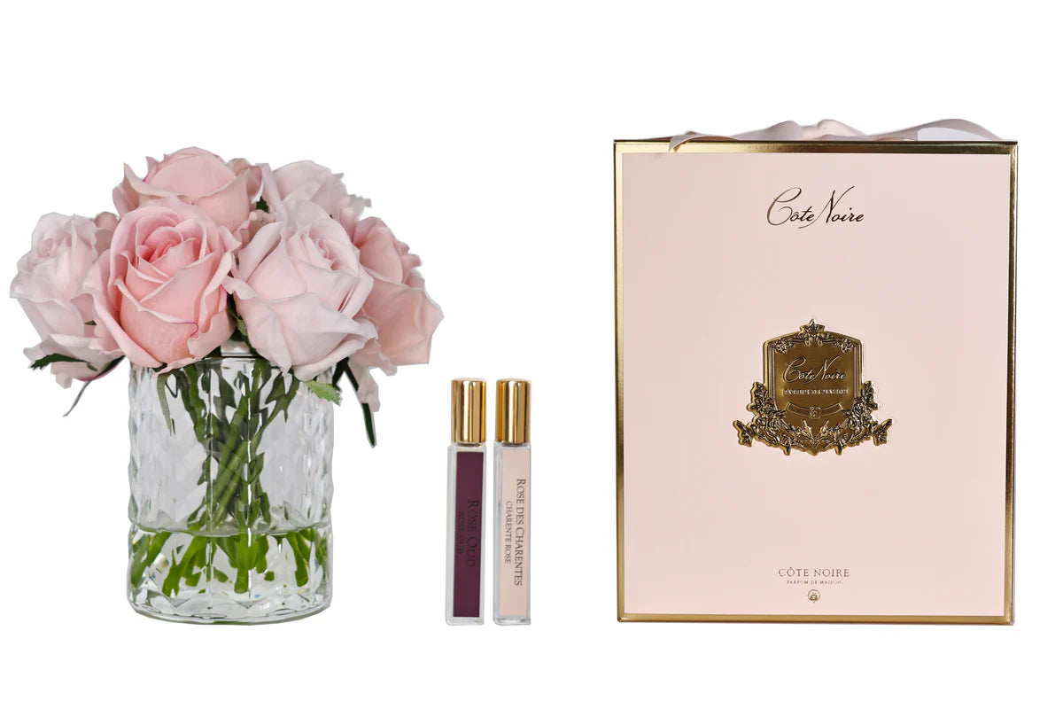 Côte Noire Herringbone Flower gift set with pink rose bud arrangement, two 10ml perfumes, and luxury pink ribboned box.