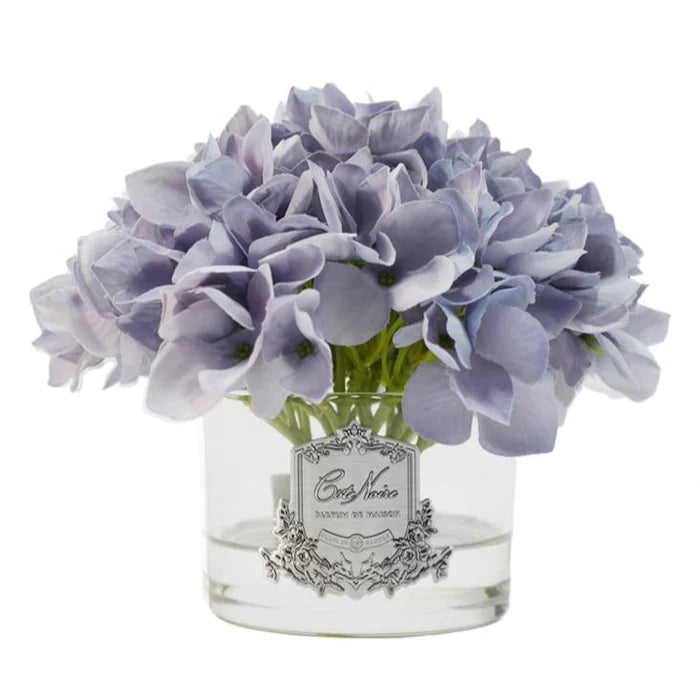 Cote Noire blue hydrangea arrangement in clear vase with lifelike natural touch petals and perfumed finish