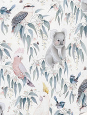 Close up of Australian bush print featuring koala kookaburra galah cockatoo and native foliage on fabric