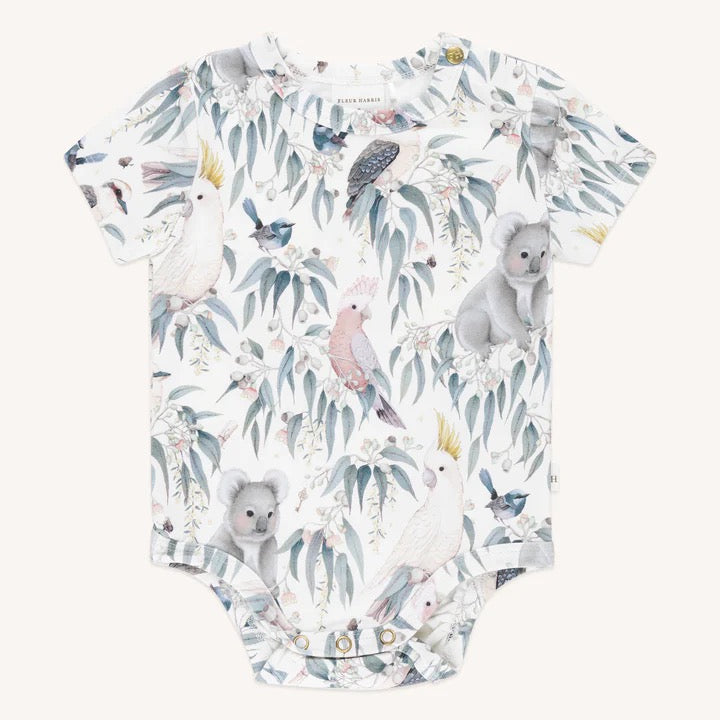 Baby bodysuit with Australian bush animals and birds pattern including koalas cockatoos galahs kookaburras and native flora