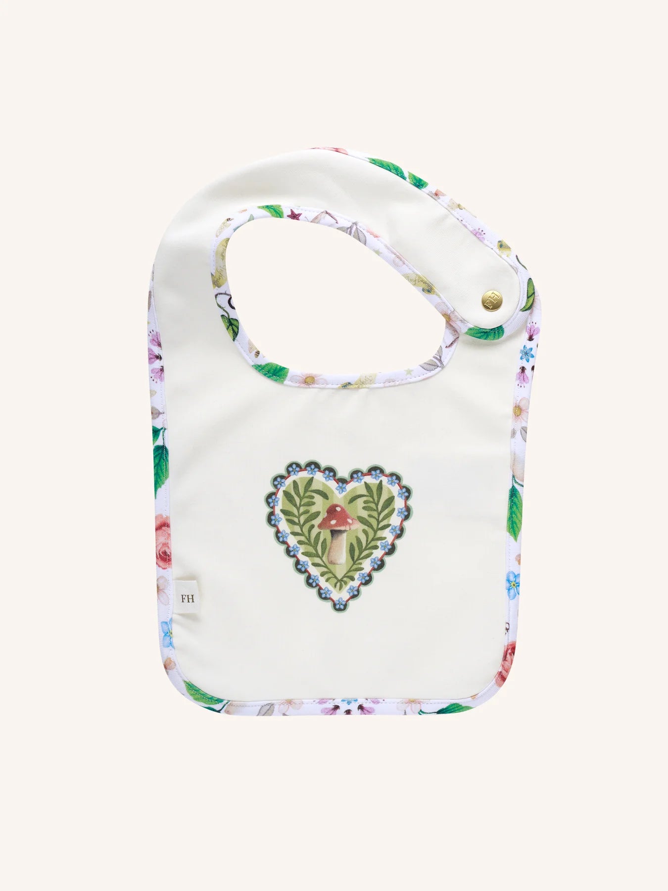 Fleur Harris Dandy Duo Bib with All My Hearts central heart motif featuring mushroom illustration, floral trim, and gold snap closure.
