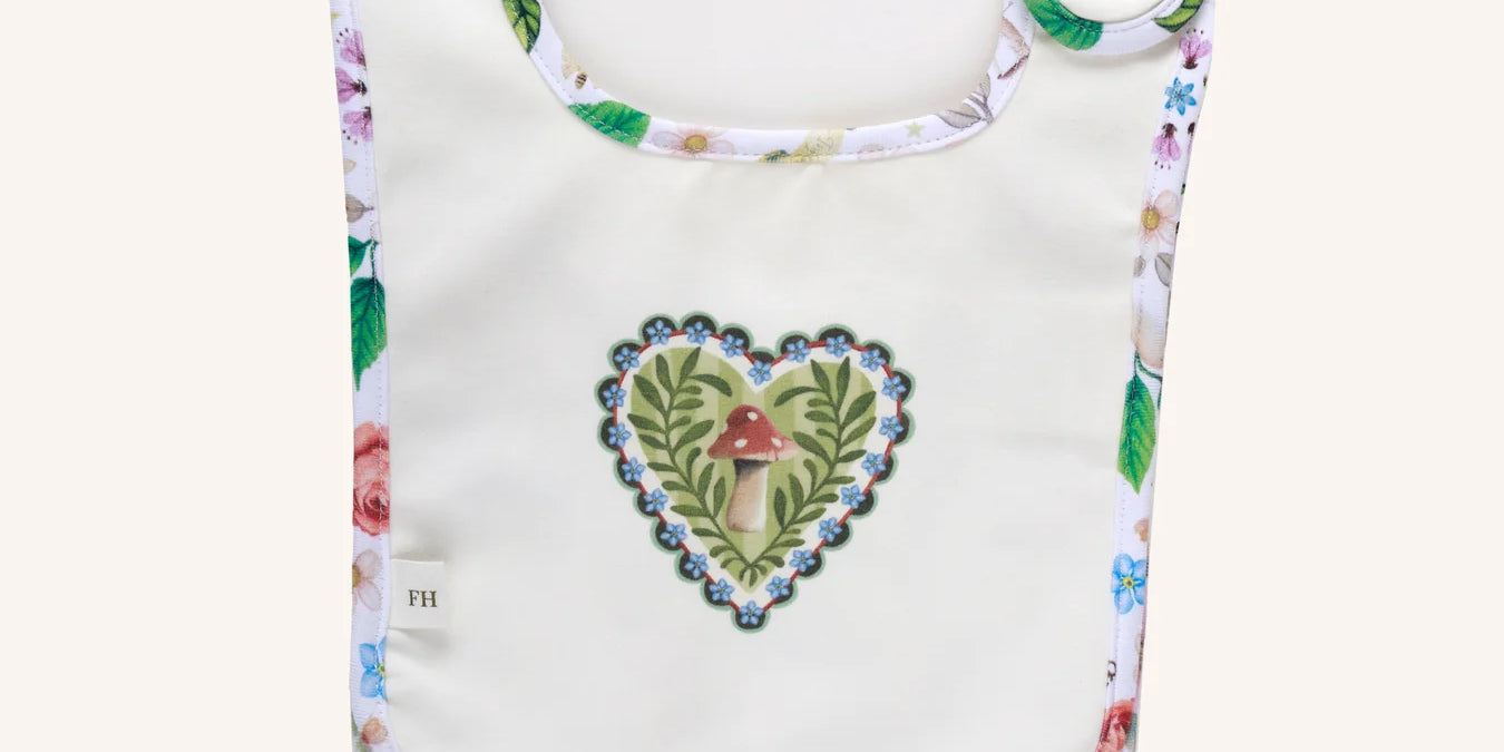 Fleur Harris Secret Diary Dandy Duo Bib set of 2 from the All My Hearts collection, featuring whimsical illustrations and gold snap closure.
