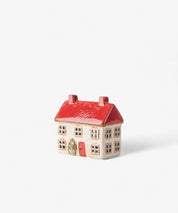 Ceramic Christmas cottage from French Country Alsace Tea Light collection, featuring red roof, hand-painted windows, and festive charm.