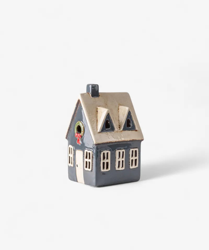 Ceramic Christmas tea light cottage by French Country, navy house with cream roof, hand-painted wreath and festive windows.