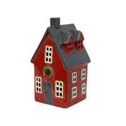 Angled side view of French Country Alsace Tea Light Cottage in red with grey roof and white windows.
