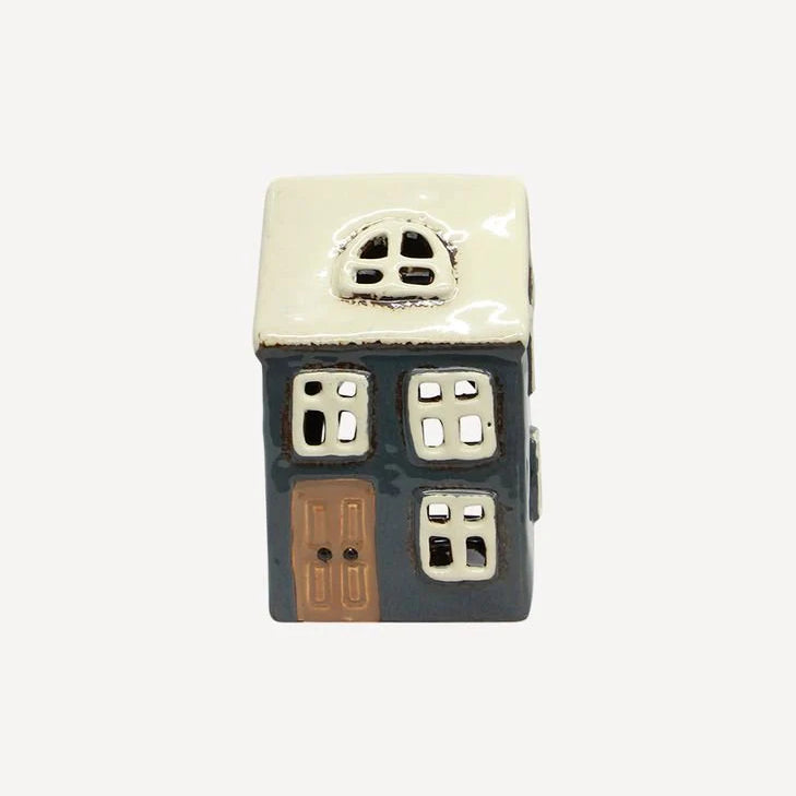 Small navy ceramic tea light house with white roof and brown door