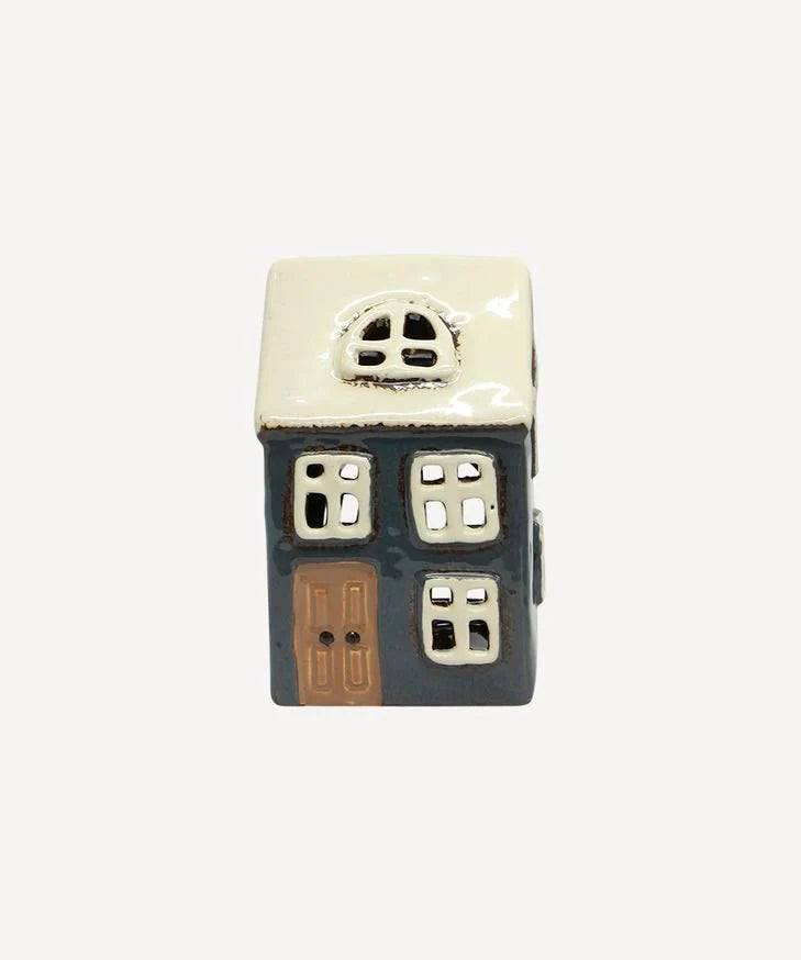 Small navy ceramic tea light house with white roof and brown door