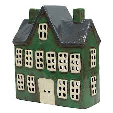 Green ceramic tea light manor house with tall gabled roof, twin chimneys, and multiple square cut-out windows
