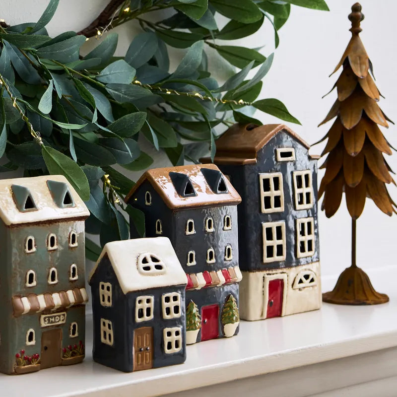 French Country Alsace Tea Light Shop navy ceramic house displayed with other tea light houses on mantel