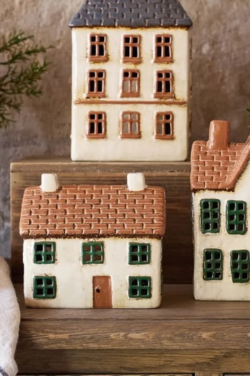 French Country Cotswolds Country Tea Light Cottage displayed with other ceramic tea light houses on wooden surface
