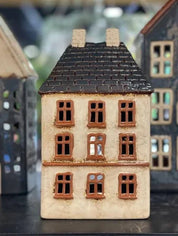 Close-up of French Country Cotswolds Country Tea Light Estate House with brown framed windows and tiled roof.