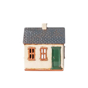 Front view of French Country Cotswolds Country Tea Light Homestead with grey tiled roof, cream walls, and green door.