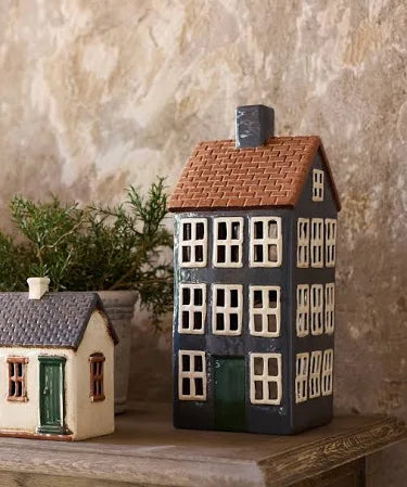 Grande Chalet ceramic tea light house styled in a rustic display with other cottage designs.