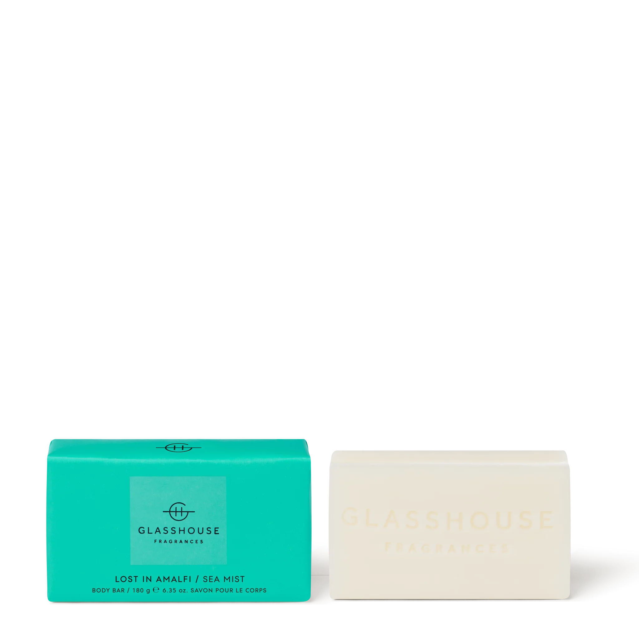  Sea Mist" 180g body bar with its turquoise packaging beside a cream-colored soap embossed with the brand name.