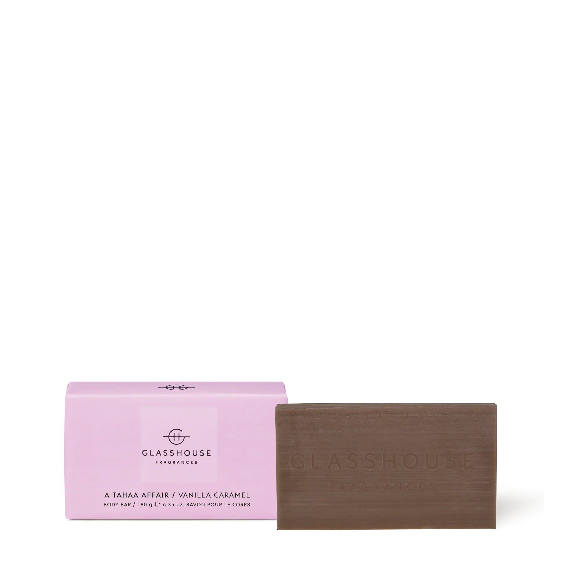 GLASSHOUSE A Tahaa Affair 180g Body Bar with pink packaging labeled Vanilla Caramel, alongside the brown soap embossed with the brand name.