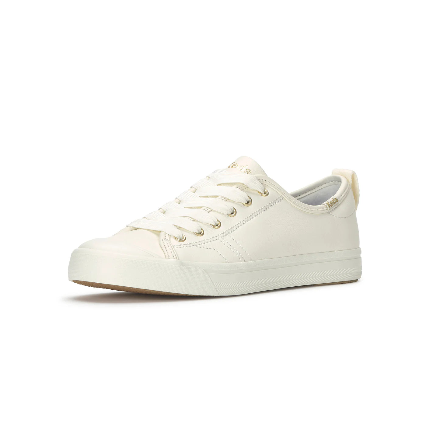 Keds Cruise Leather Egret Gold sneakers side view off white leather lace up shoes with sleek gold accents cushioned comfort footbed and flexible lightweight sole casual everyday women’s footwear