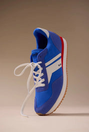 Keds Rena Nylon Suede sneaker in blue, white, and red shown at an angled floating view.