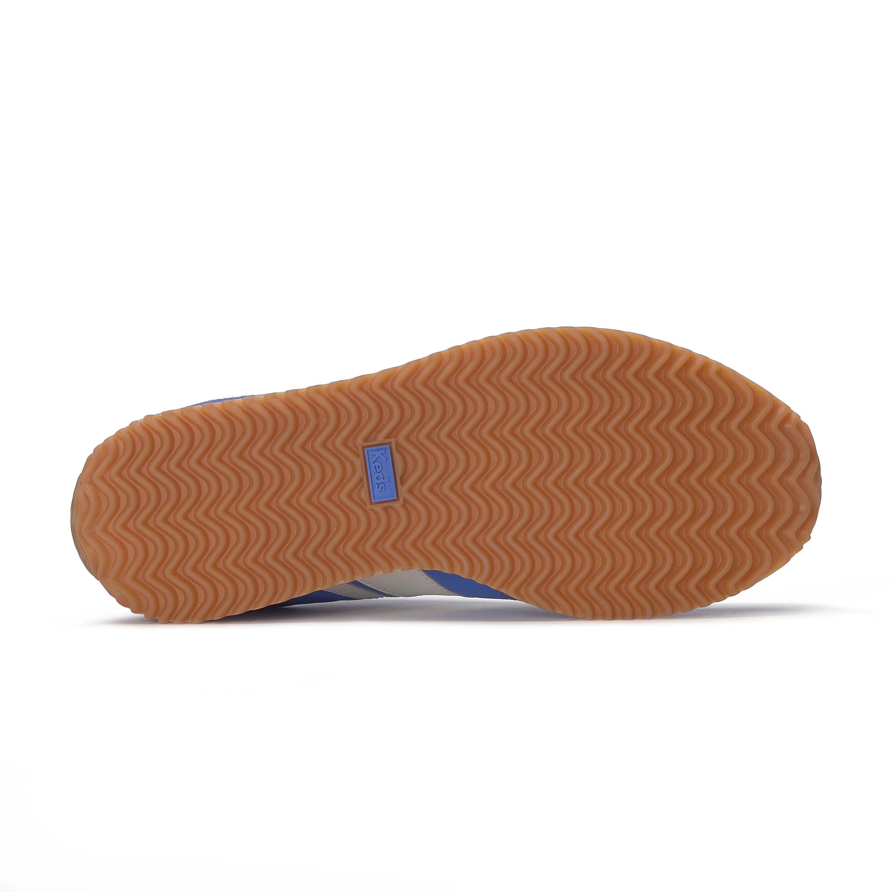 Gum rubber outsole of the Keds Rena Nylon Suede sneaker with wave tread pattern.