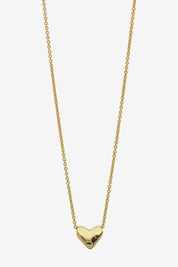 Close-up of the LIBERTE Mariel Soft Gold Heart Necklace featuring a delicate gold chain with a soft, rounded gold heart pendant.