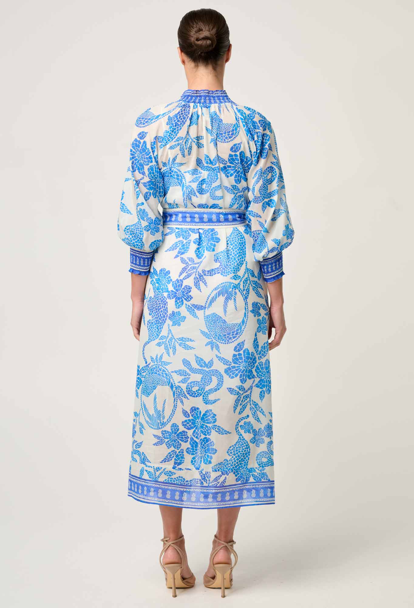 Back studio view of ONCE WAS Carmen Silk Cotton Maxi Dress in Azure Mosaic showing blue floral pattern and waist tie.