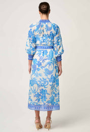 Back studio view of ONCE WAS Carmen Silk Cotton Maxi Dress in Azure Mosaic showing blue floral pattern and waist tie.