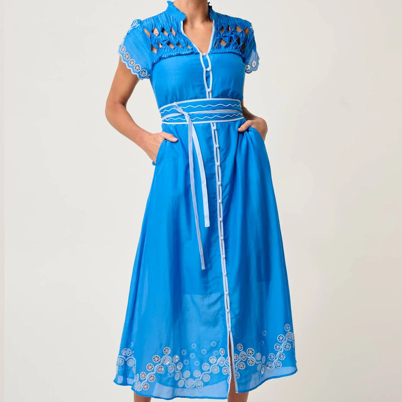 Front studio view of ONCE WAS Xanthia Diamond Smock Yoke Silk Cotton Embroidered Dress in Blue Topaz with belted waist and embroidered details.