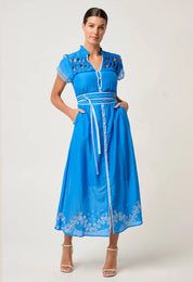 Front studio view of ONCE WAS Xanthia Diamond Smock Yoke Silk Cotton Embroidered Dress in Blue Topaz with belted waist and embroidered details.