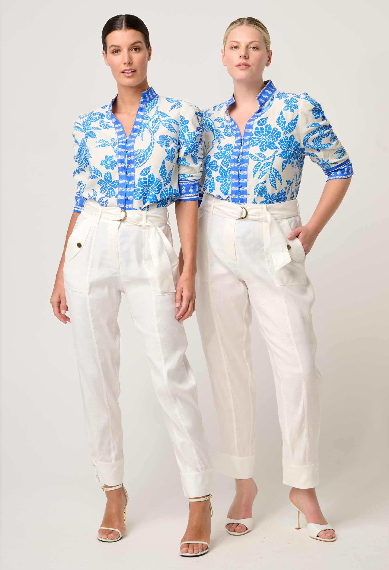 Two models wearing ONCE WAS Calantha viscose dobby rouched sleeve shirt in azure mosaic