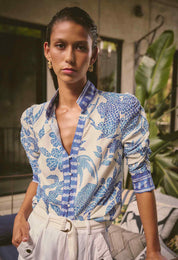 Model wearing ONCE WAS Calantha viscose dobby rouched sleeve shirt in azure mosaic close up