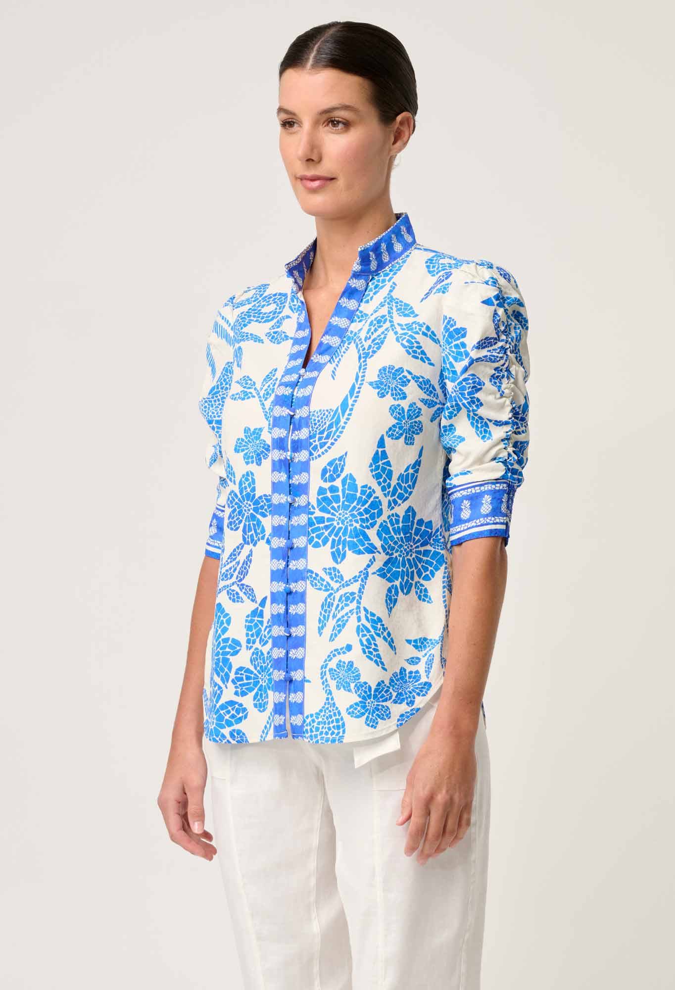 Model wearing ONCE WAS Calantha viscose dobby rouched sleeve shirt in azure mosaic side view