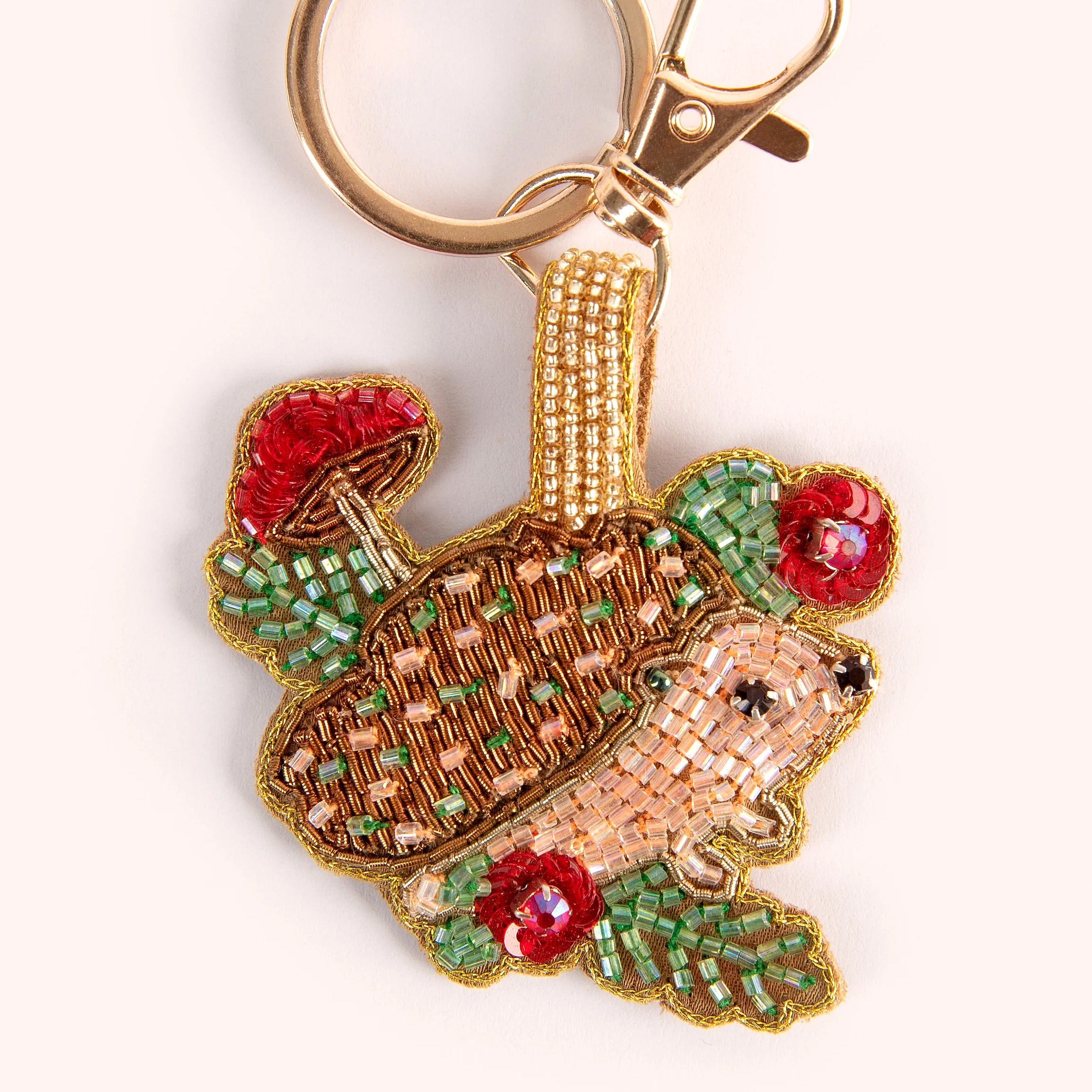 POWDER beaded hedgehog keyring with gold ring and clasp.