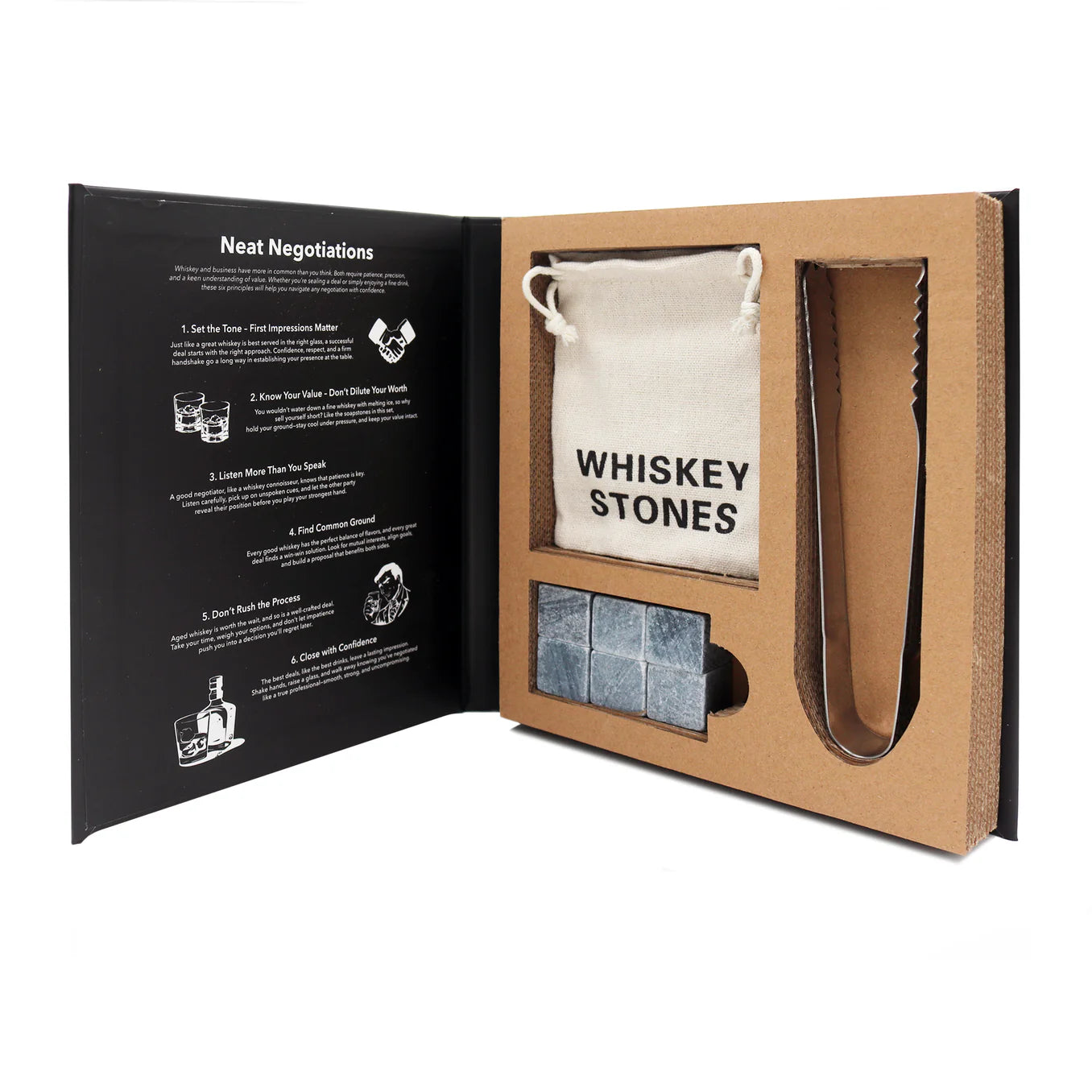 The Premium Whiskey Stone Collection Book Box open, showing reusable whiskey stones, pouch, and stainless steel tongs