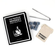 The Premium Whiskey Stone Collection set displayed with pouch, tongs, and whiskey stones