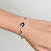 VON TRESKOW Ball Bracelet with Clasp and Round Black Onyx and Blue Topaz Pendant